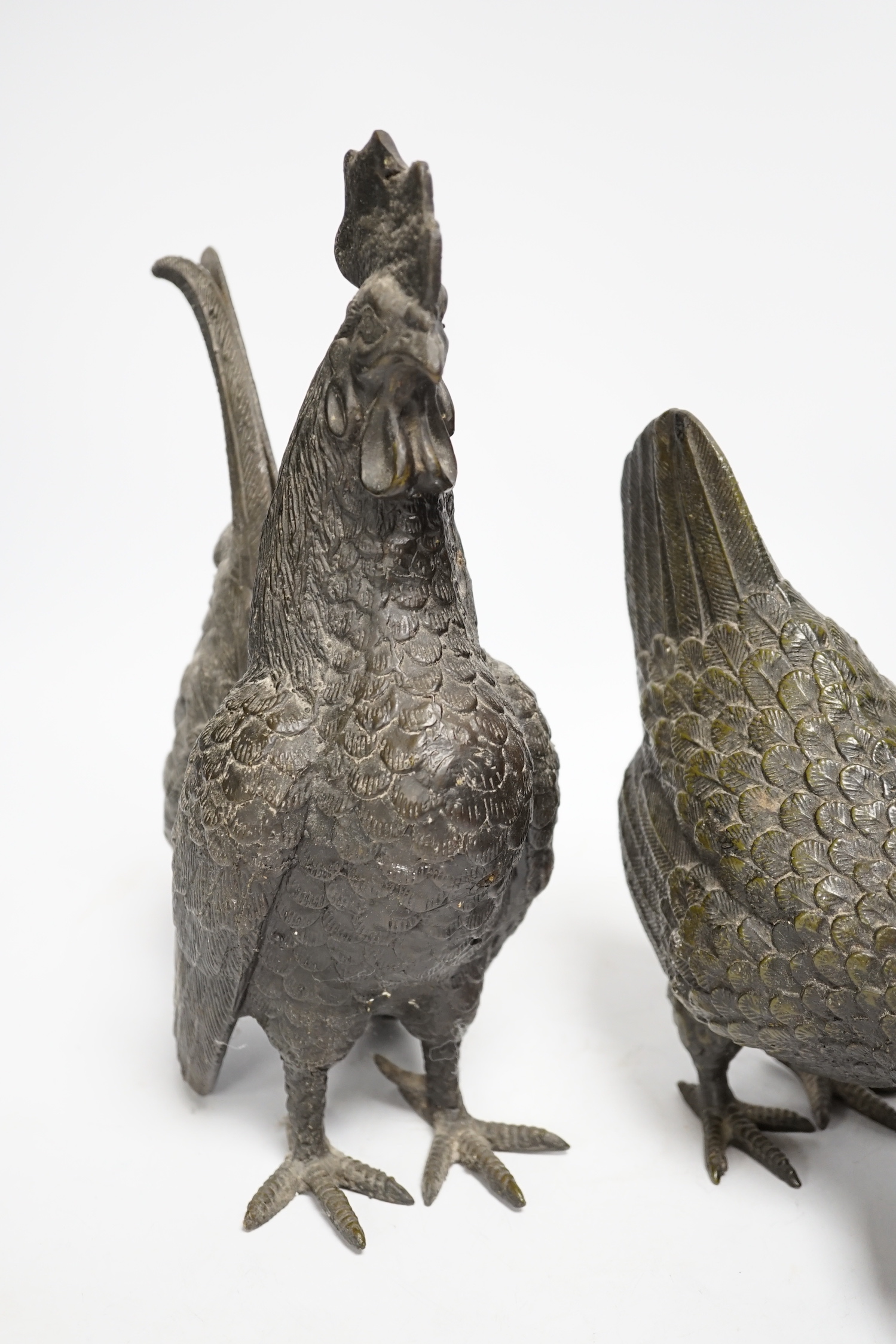 A pair of modern bronze models of a cockerel and chicken, largest 29cm high